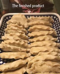 A plate filled with pierogi.